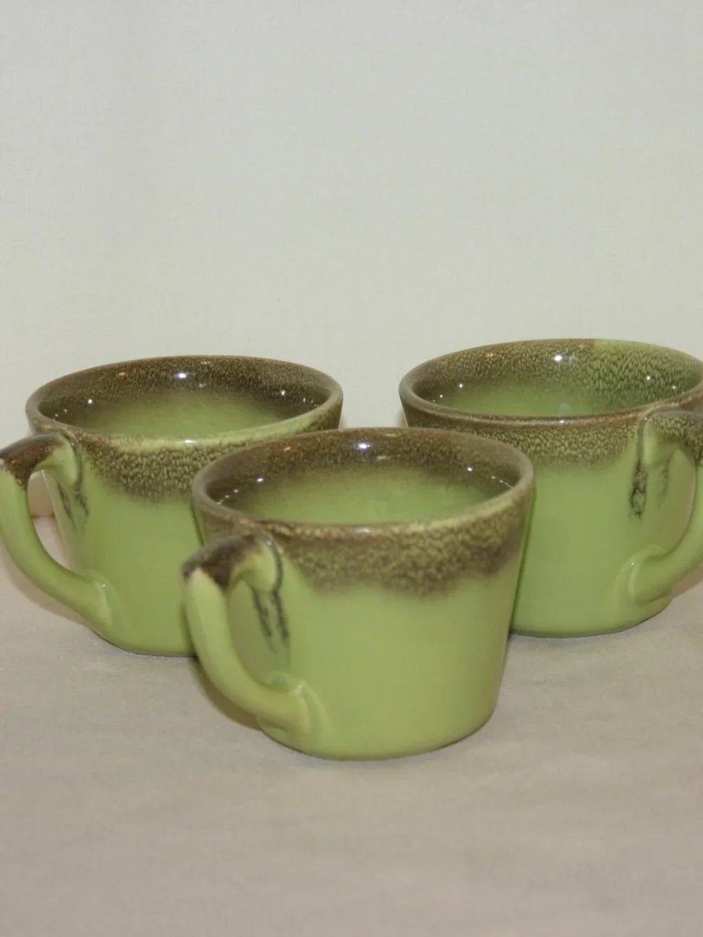 A Set of 3 MCM Bauer Mission Moderne Coffee Cups Chartreuse & Brown B-313